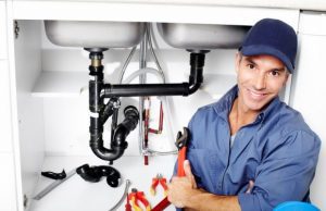 plumber posing in a camera after working photo