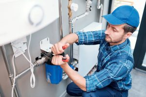 plumber photo while installing water heater